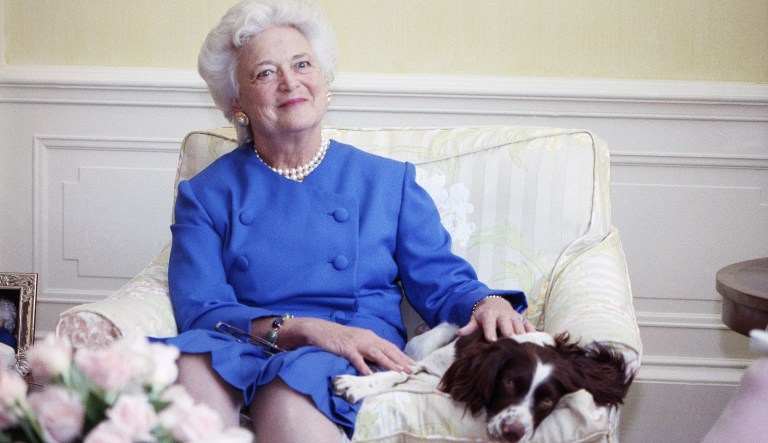 Former first lady Barbara Bush poses with her dog Millie in Washington. A family spokesman said Tuesday that former first lady Barbara Bush has died at the age of 92.