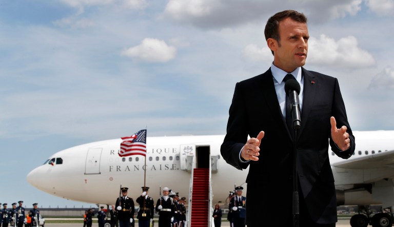 French President Emmanuel Macron speaks on arrival at Andrews Air Force Base, Md., Monday. President Trump will be hosting Macron at a glitzy White House state visit.