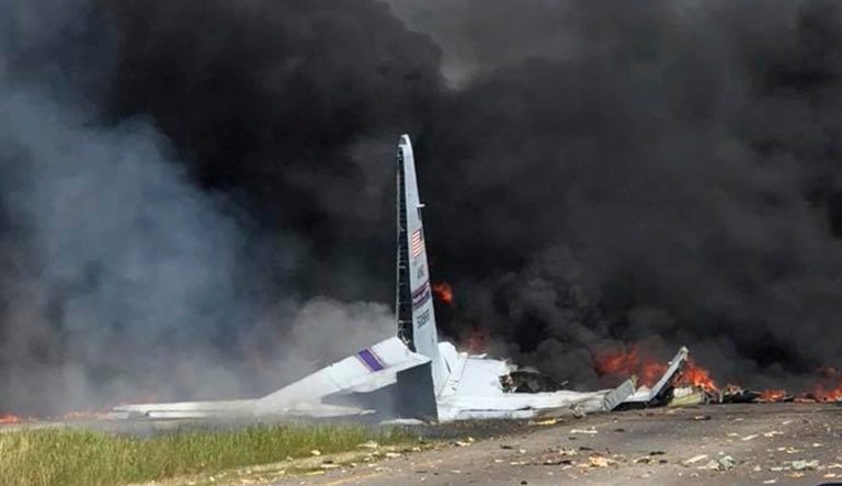 Flames and smoke rise from an Air National Guard C-130 cargo plane after it crashed near Savannah, Ga., Wednesday. 