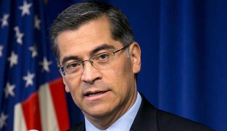 California Attorney General Xavier Becerra responds to a question during a news conference in Sacramento, California.  