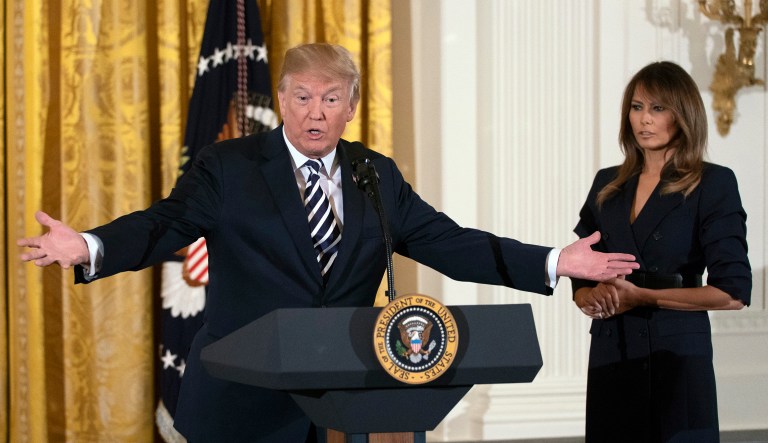 President Trump, joined by first lady Melania Trump, speaks in the East Room of the White House during an event to celebrate military mothers and spouses. 