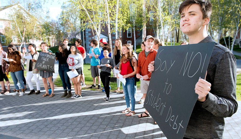 Students rallied through the heart of the campus Friday, calling on the college to join a national movement to offer more grants to low-income students so none have to rely on loans to attend Bates. 