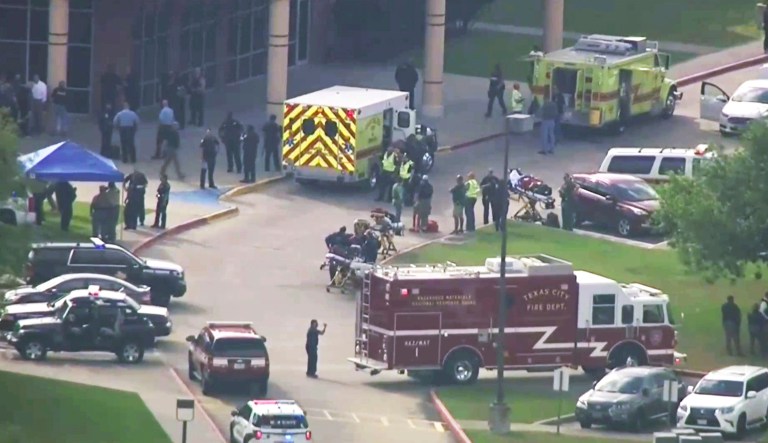 Emergency personnel and law enforcement officers respond to a high school near Houston after an active shooter was reported on campus, Friday in Santa Fe, Texas. The Santa Fe school district issued an alert Friday morning saying Santa Fe High School has been placed on lockdown. 