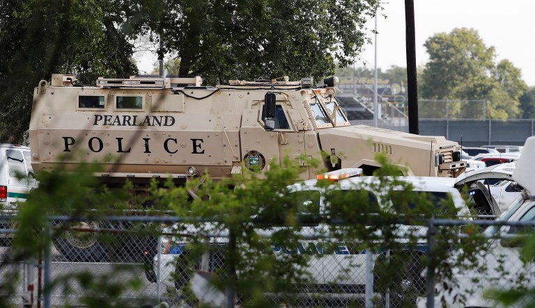 A Pearland Police armored vehicle stands ready in front of Santa Fe High School in Santa Fe, Texas, in response to a shooting on Friday.