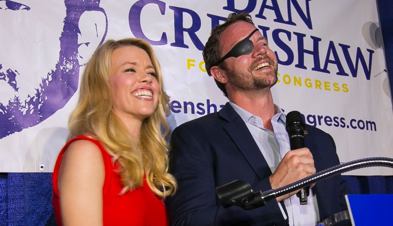 Republican congressional candidate Dan Crenshaw reacts to the crowd with his wife, Tara, as he comes on stage to deliver a victory speech during an election night party at the Cadillac Bar, Tuesday, May 22, 2018 in Houston. Crenshaw was in a run-off with Kevin Roberts for Texas congressional district 2. 