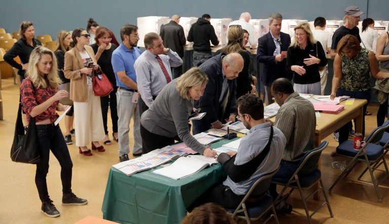 People vote at a polling place set up in an elementary school in Los Angeles. California's primary election on Tuesday includes races for governor, U.S. Senate and other statewide offices, all 53 U.S. districts and most seats in the legislature. 