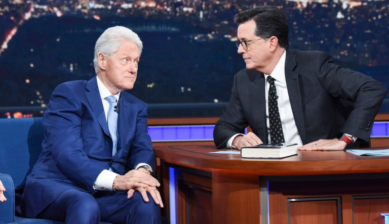 Former President Bill Clinton appears with host Stephen Colbert while promoting his book "The President is Missing," on "The Late Show with Stephen Colbert." Tuesday. 