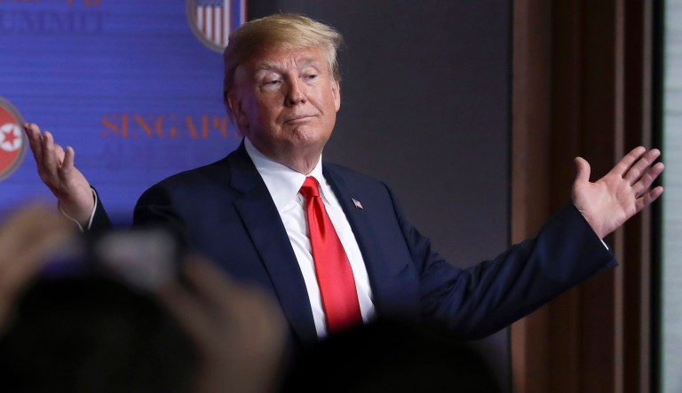 President Trump gestures as he leaves a press conference at the Capella resort on Sentosa Island Tuesday in Singapore. 