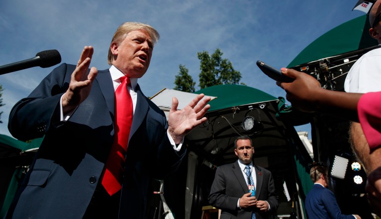 President Trump speaks to reporters at the White House. 