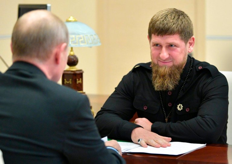 Russian President Vladimir Putin speaks to Chechen regional leader Ramzan Kadyrov, right, during a meeting at the Novo-Ogaryovo residence outside Moscow, Russia, Friday, June 15, 2018. 