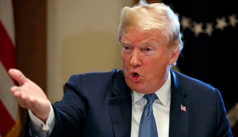 President Trump speaks during a meeting with Republican lawmakers in the Cabinet Room of the White House. 