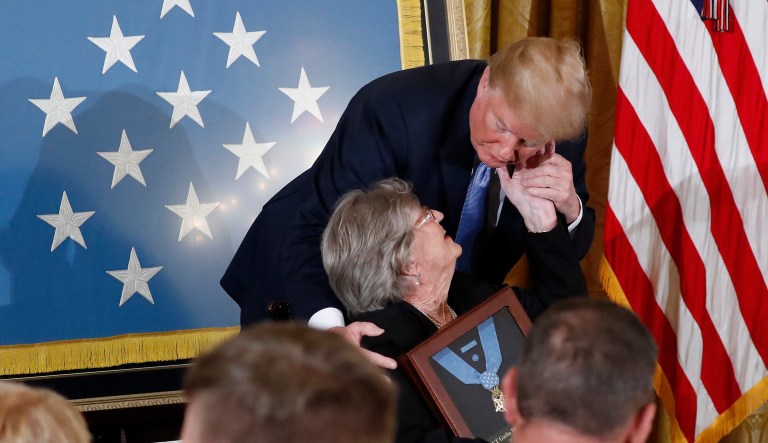 President Donald Trump awards the Medal of Honor to 1st Lt. Garlin Conner as his widow Pauline Connor accepts the posthumous recognition, during a ceremony in the East Room of the White House in Washington, Tuesday, June 26, 2018. Conner is being recognized for actions on Jan. 24, 1945, when he left a position of relative safety for a better position "to direct artillery fire onto the assaulting enemy infantry and armor." Conner remained in an exposed position for three hours, despite German forces coming within five yards of his position and friendly artillery shells exploding around him.
