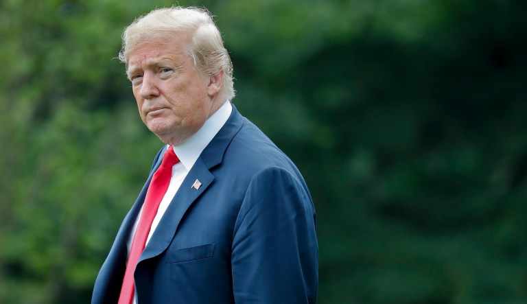 President Trump walks across the South Lawn of the White in Washington. 
