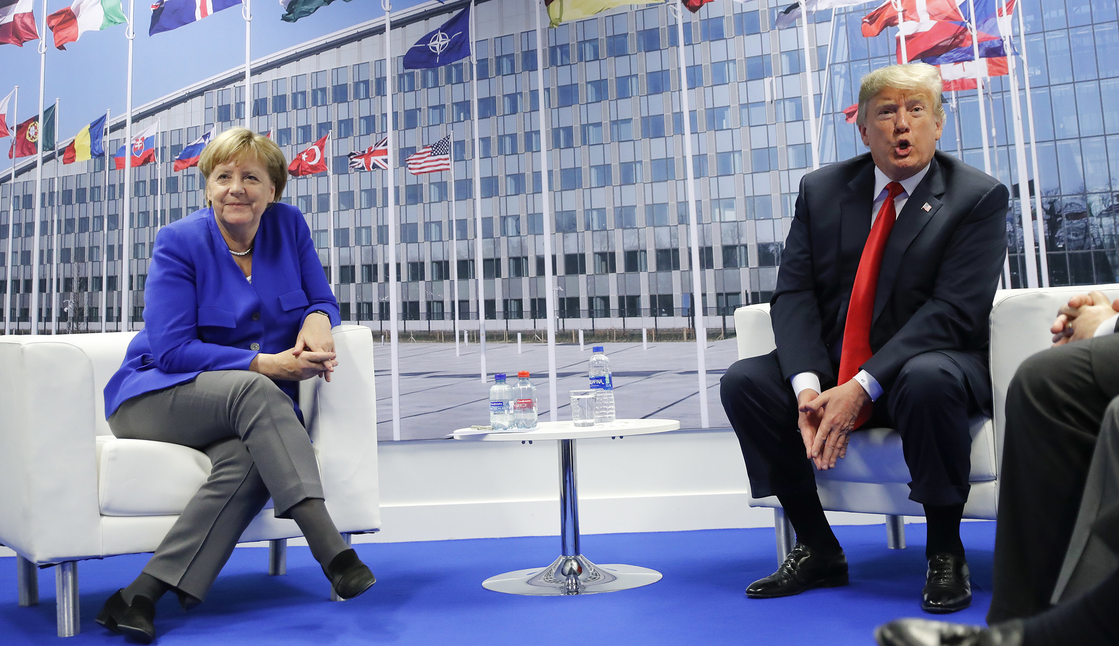 Trump meets Angela Merkel at NATO summit after accusing Germany of being a ‘captive’ of Russia