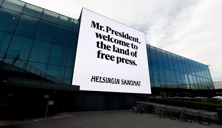 An advert by Finnish newspaper Helsingin Sanomat stating "Mr. President, welcome to the land of free press" is seen on the wall of Helsinki Music Centre in Helsinki. President Trump is meeting Russian President Vladimir Putin on Monday. 