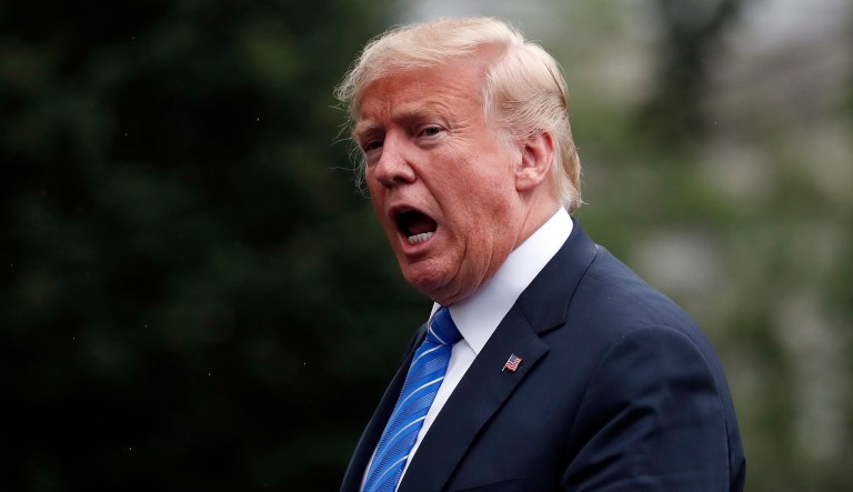 President Trump speaks walks on the South Lawn after stepping off Marine One at the White House. 
