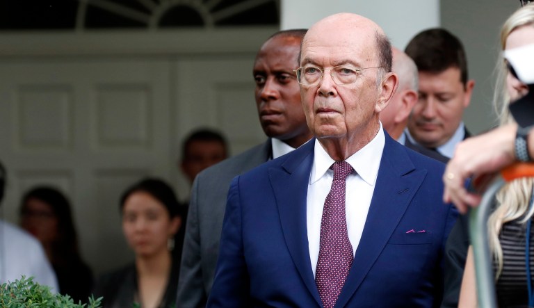 Commerce Secretary Wilbur Ross stands as President Trump and European Commission President Jean-Claude Juncker speak in the Rose Garden of the White House.