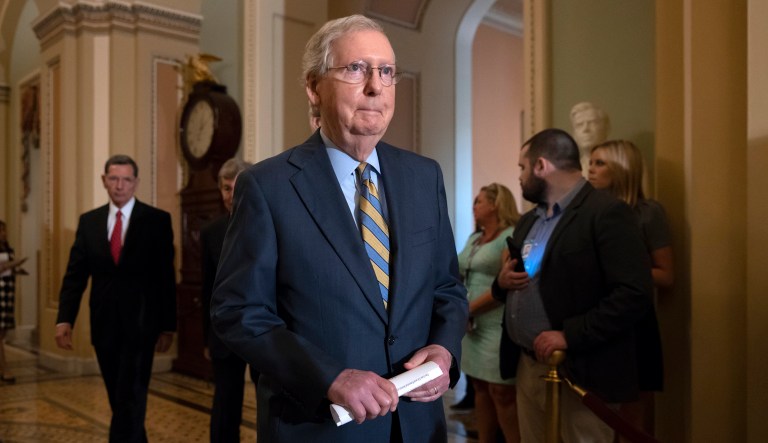 Senate Majority Leader Mitch McConnell, R-Ky., arrives to speak with reporters on Capitol Hill in Washington. 