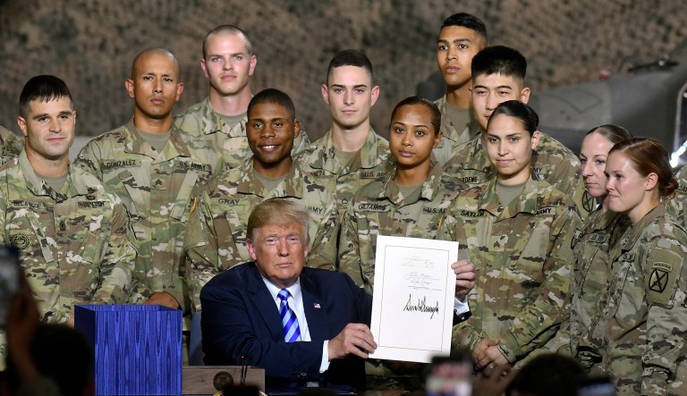 President Trump signs the John McCain National Defense Authorization Act for the Fiscal Year 2019, during a signing ceremony on Aug. 13, 2018, in Fort Drum, N.Y.