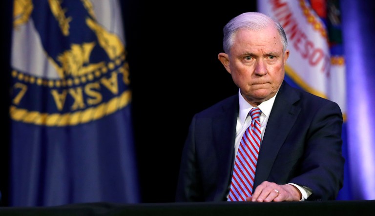 Attorney General Jeff Sessions waits to speak at the Eighth Judicial District Conference. 