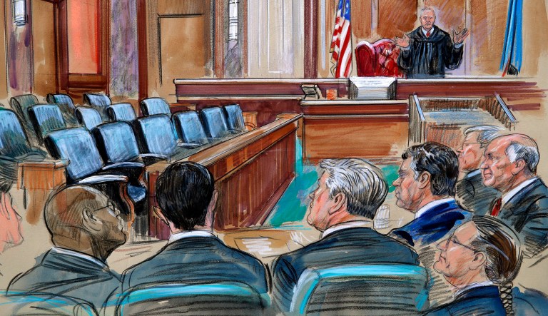 U.S. District court Judge T.S. Ellis III speaks to the lawyers and defendant Paul Manafort, fourth from left, as the jury continues to deliberate in Manafort's trial on bank fraud and tax evasion at federal court in Alexandria, Va. 
