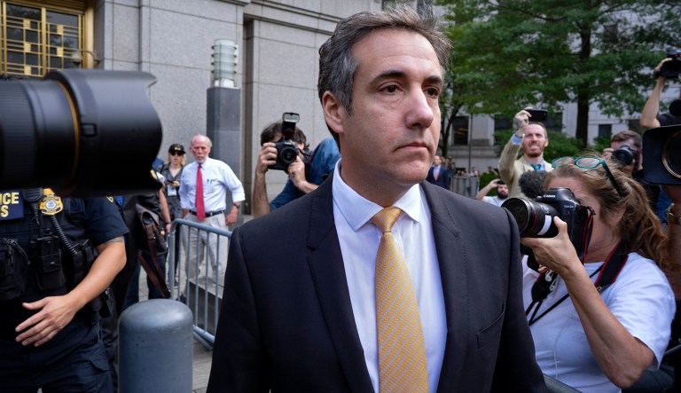 Michael Cohen, former personal lawyer to President Trump, leaves federal court after reaching a plea agreement in New York. 