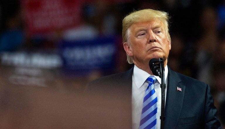 President Trump takes the stage at a rally in support of the Senate candidacy of West Virginia's Attorney General Patrick Morrisey. 