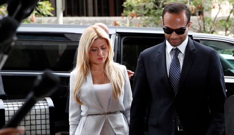 Former Donald Trump presidential campaign foreign policy adviser George Papadopoulos, who pleaded guilty to one count of making false statements to the FBI during the agency's Russia probe, holds hands with his wife Simona Mangiante, as they arrive at federal court for sentencing, Friday in Washington. 