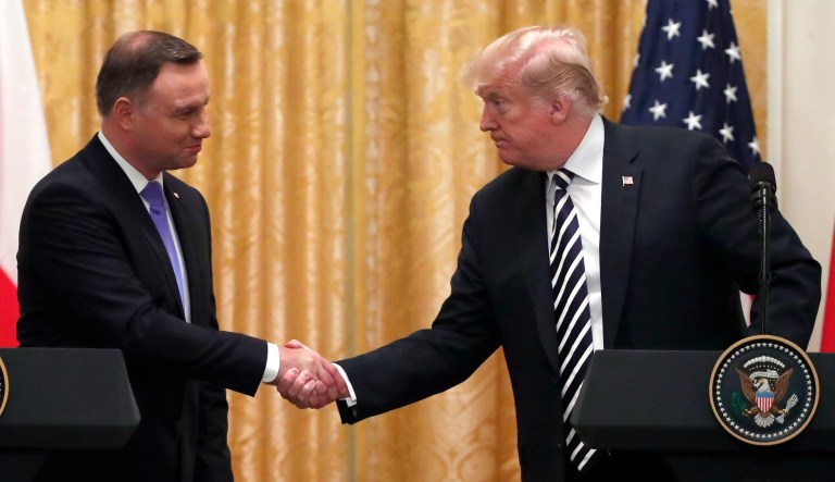 President Trump shakes hands with Polish President Andrzej Duda during a news conference in the East Room of the White House, Sept. 18, 2018, in Washington.