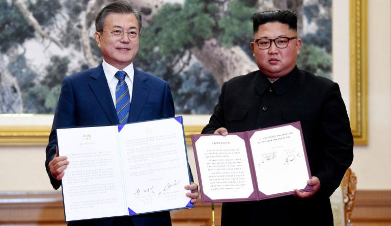 South Korean President Moon Jae-in and North Korean leader Kim Jong Un hold documents after signing at the Paekhwawon State Guesthouse in Pyongyang, North Korea, Wednesday. This week's inter-Korean summit talks ended with a set of sweeping agreements on denuclearization of the Korean Peninsula, reducing a military standoff and other reconciliation issues. 