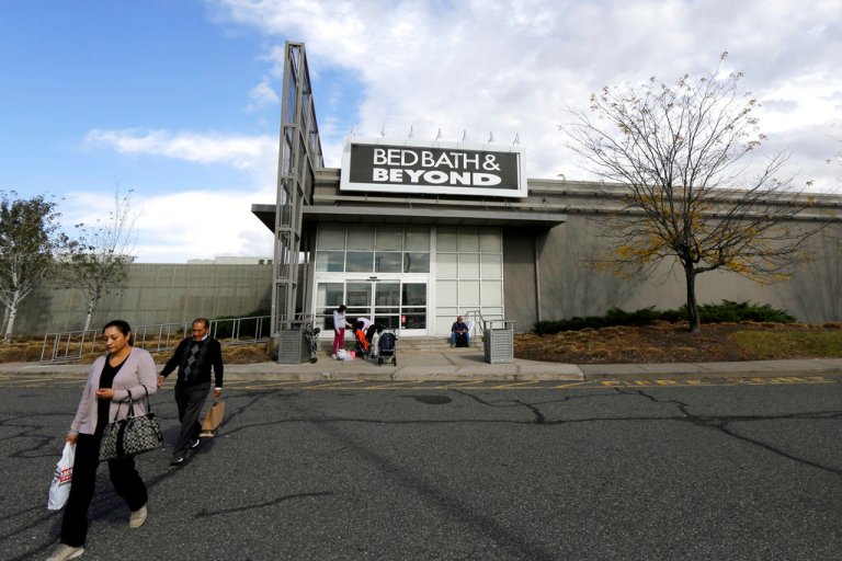 Shoppers walk toward their vehicles outside of a Bed Bath & Beyond department store at Jersey Gardens Mall in Elizabeth, New Jersey.