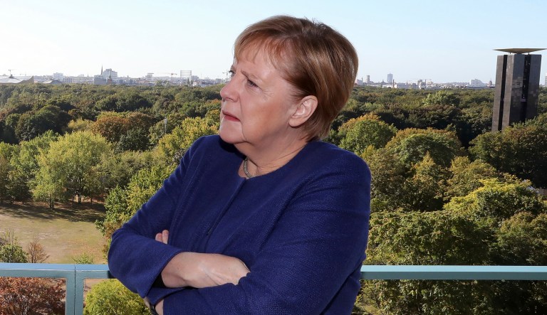 German Chancellor Angela Merkel listens as Turkish President Recep Tayyip Erdogan speaks prior to a breakfast meeting at the chancellery in Berlin, Germany, Saturday, Sept. 29, 2018.