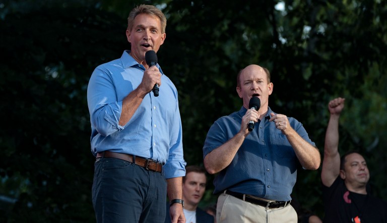 Sen. Jeff Flake, R-Ariz., left , and Sen. Chris Coons, D-Del., stand together as they address festival participants during the 2018 Global Citizen Festival Saturday, Sept. 29, 2018, in New York.