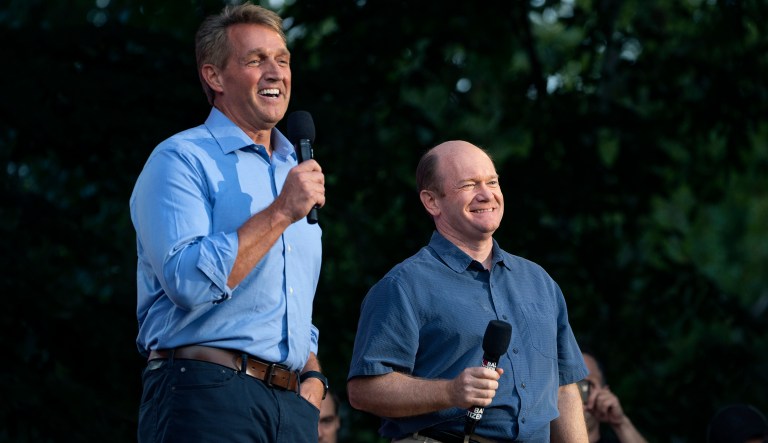 Sen. Jeff Flake, R- Ariz., left, and Sen. Chris Coons, D-Del., stand together as they address festival participants during the 2018 Global Citizen Festival Saturday, Sept. 29, 2018, in New York.