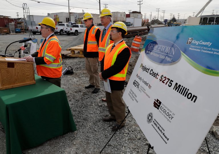 Andrew Wheeler, left, then the acting administrator of EPA, talks to reporters, Oct. 3, 2018, after touring the Georgetown Wet Weather Treatment Station in Seattle, a project funded by a low-interest loan from the EPA. The facility will treat millions of gallons of polluted stormwater that currently flows into Duwamish River during severe rainstorms.