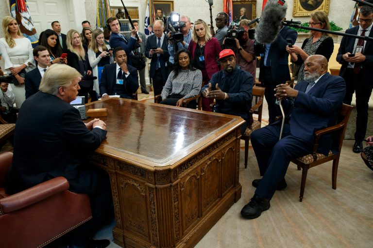 President Donald Trump meets with musician Kanye West and former football player Jim Brown in the Oval Office of the White House, Thursday, Oct. 11, 2018, in Washington to discuss racial issues and prison reform.