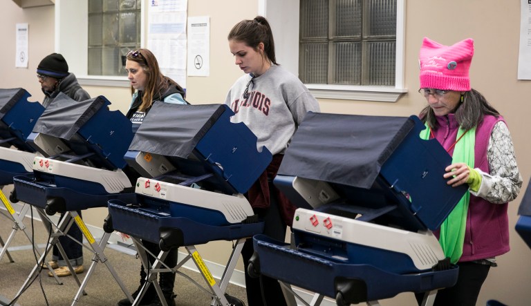 A group of women early vote in the midterm elections after the Women's March Chicago on Saturday, Oct. 13, 2018 in Chicago.