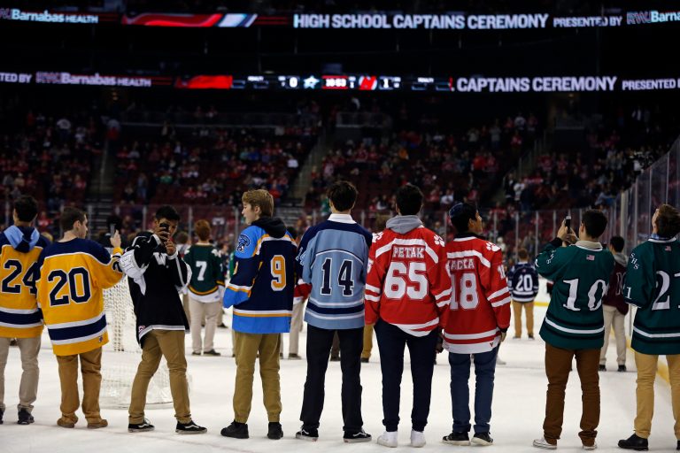 High school slammed as racist after elementary-age hockey fans flash ‘OK’ symbol