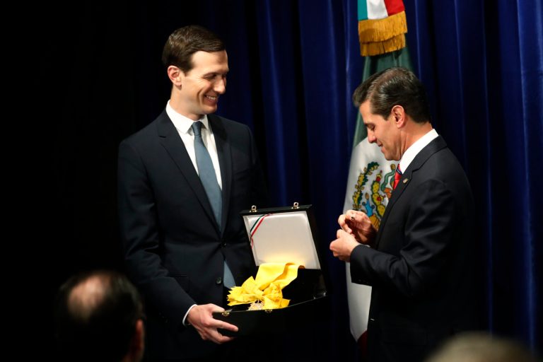 Former Mexican President Enrique Pena Nieto, right, awards White House Senior Adviser Jared Kushner with The Order of the Aztec Eagle, the highest Mexican order awarded to foreigners, Friday, Nov. 30, 2018 in Buenos Aires, Argentina.
