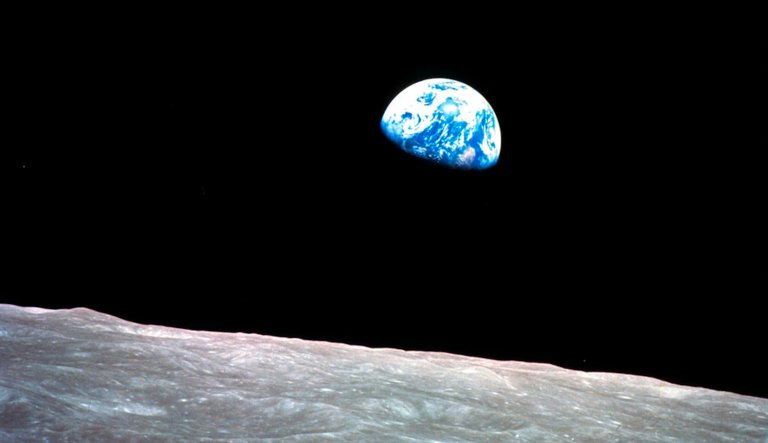 FILE - This Dec. 24, 1968, file photo made available by NASA shows the Earth behind the surface of the moon during the Apollo 8 mission.