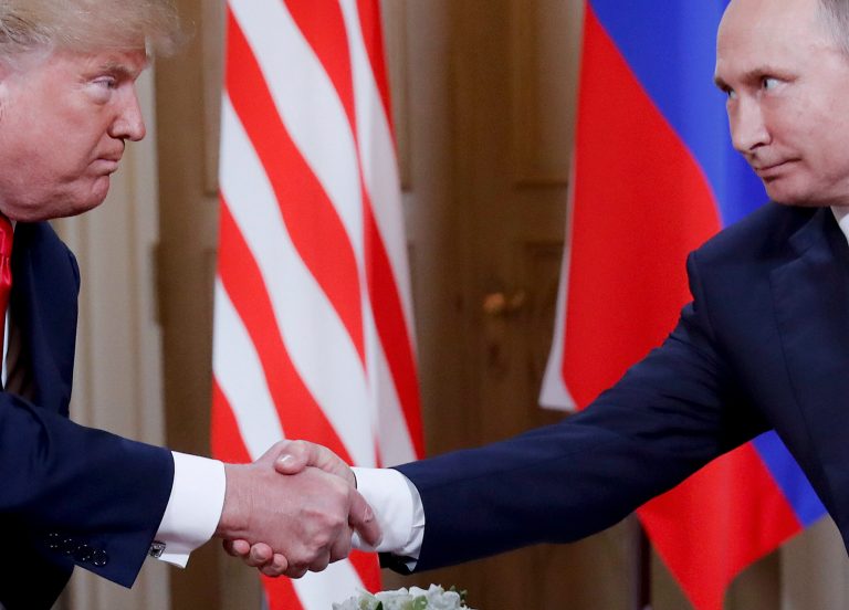 In this Monday, July 16, 2018 file photo, President Donald Trump, left, and Russian President Vladimir Putin, right, shake hand at the beginning of a meeting at the Presidential Palace in Helsinki, Finland.