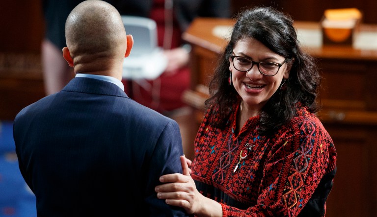 In this Jan. 3, 2019 photo, then Rep.-elect Rashida Tlaib of Michigan, stands with with Rep. Hakeem Jeffries, D-N.Y., on the house floor before being sworn into the 116th Congress at the U.S. Capitol in Washington.