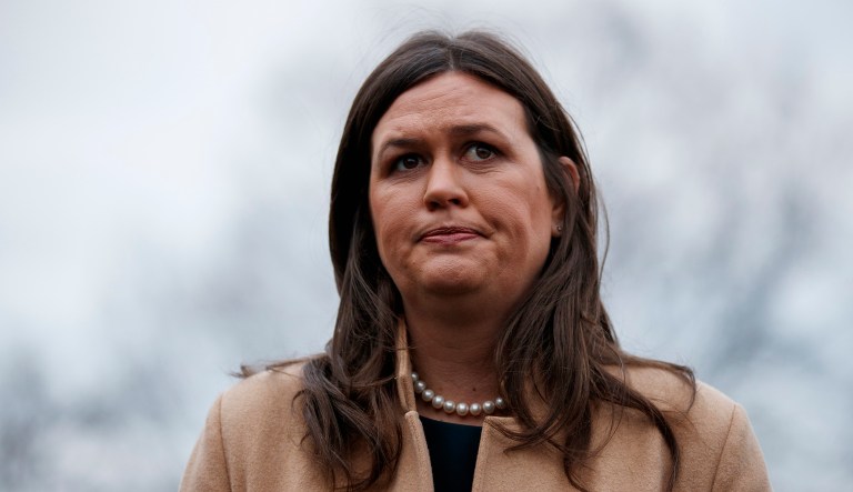 White House press secretary Sarah Sanders talks with reporters outside the White House, Wednesday, Jan. 9, 2019, in Washington. 
