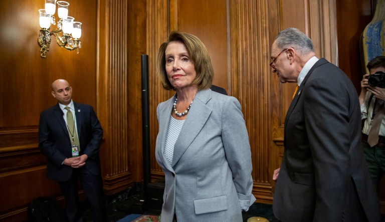 Speaker of the House Nancy Pelosi, D-Calif., and Senate Minority Leader Chuck Schumer, D-N.Y., right, leave an event with furloughed federal workers amid the partial government shutdown, on Capitol Hill in Washington, Wednesday, Jan. 9, 2019. 