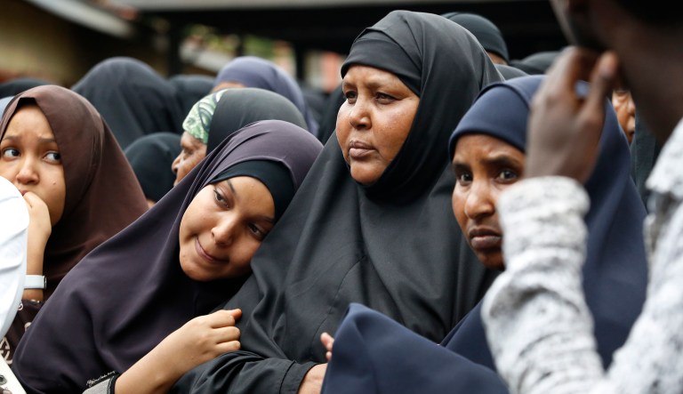 Family members including the mother of Abdalla, center, prepare to pray over the bodies of Abdalla Dahir and Feisal Ahmed, who were both killed in Tuesday's attack, at a mosque in Nairobi, Kenya.