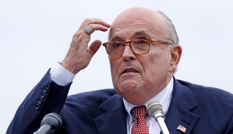 In this Aug. 1, 2018 file photo, Rudy Giuliani, an attorney for President Trump, addresses a gathering during a campaign event fin Portsmouth, N.H.