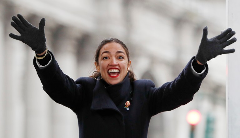 Rep. Alexandria Ocasio-Cortez, D-N.Y., waves to the crowd as she steps onto the stage at the Women's Unity Rally organized by Women's March NYC in Lower Manhattan, Saturday, Jan. 19, 2019, in New York.