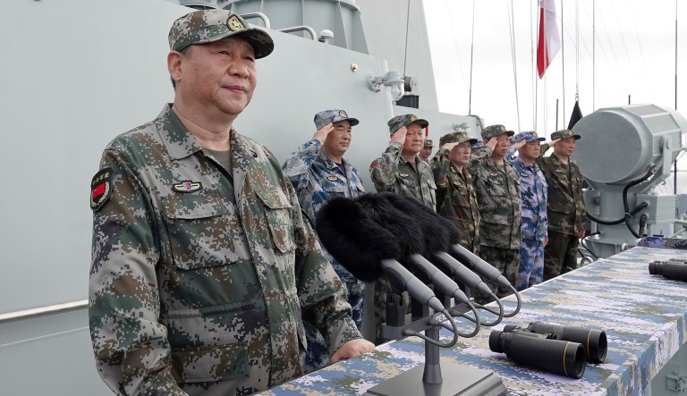 In this April 12, 2018, file photo released by Xinhua News Agency, Chinese President Xi Jinping speaks after reviewing the Chinese People's Liberation Army (PLA) Navy fleet in the South China Sea. A new Pentagon report lays out U.S. concerns about China's growing military might, underscoring worries about a possible attack against Taiwan. The report's release on Jan. 15, 2019 came just a week after Chinese President Xi Jinping called on his People's Liberation Army to better prepare for combat.