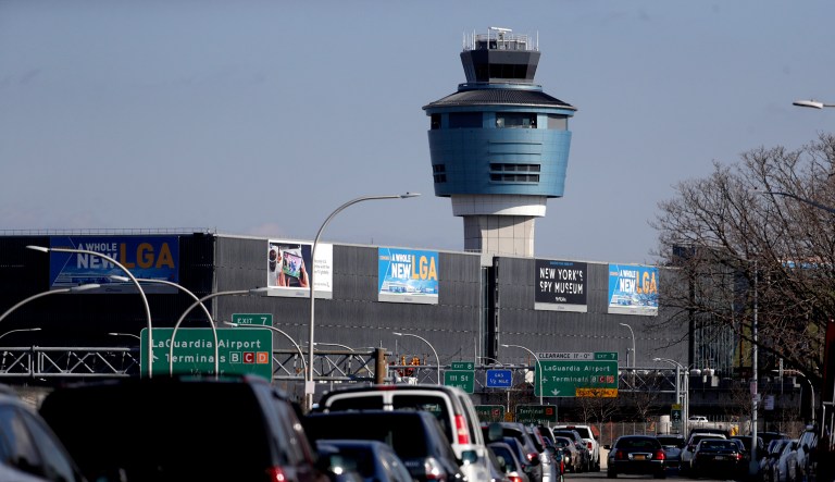 The air traffic control tower at LaGuardia Airport is seen, Friday, Jan. 25, 2019, in New York. New York Gov. Andrew Cuomo says delays at East Coast airports amid a partial federal government shutdown are another symptom of the "federal madness" caused by Republican President Donald Trump. Earlier Friday, the FAA announced LaGuardia Airport and Newark Liberty International Airport in New Jersey were both experiencing delays in takeoffs due to staffing problems at two air traffic control facilities. 