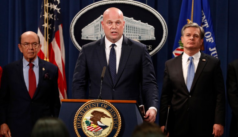 Acting Attorney General Matt Whitaker, center, with Commerce Secretary Wilbur Ross, left, and FBI Director Christopher Wray speak Monday, Jan. 28, 2019, at the Justice Department in Washington. 